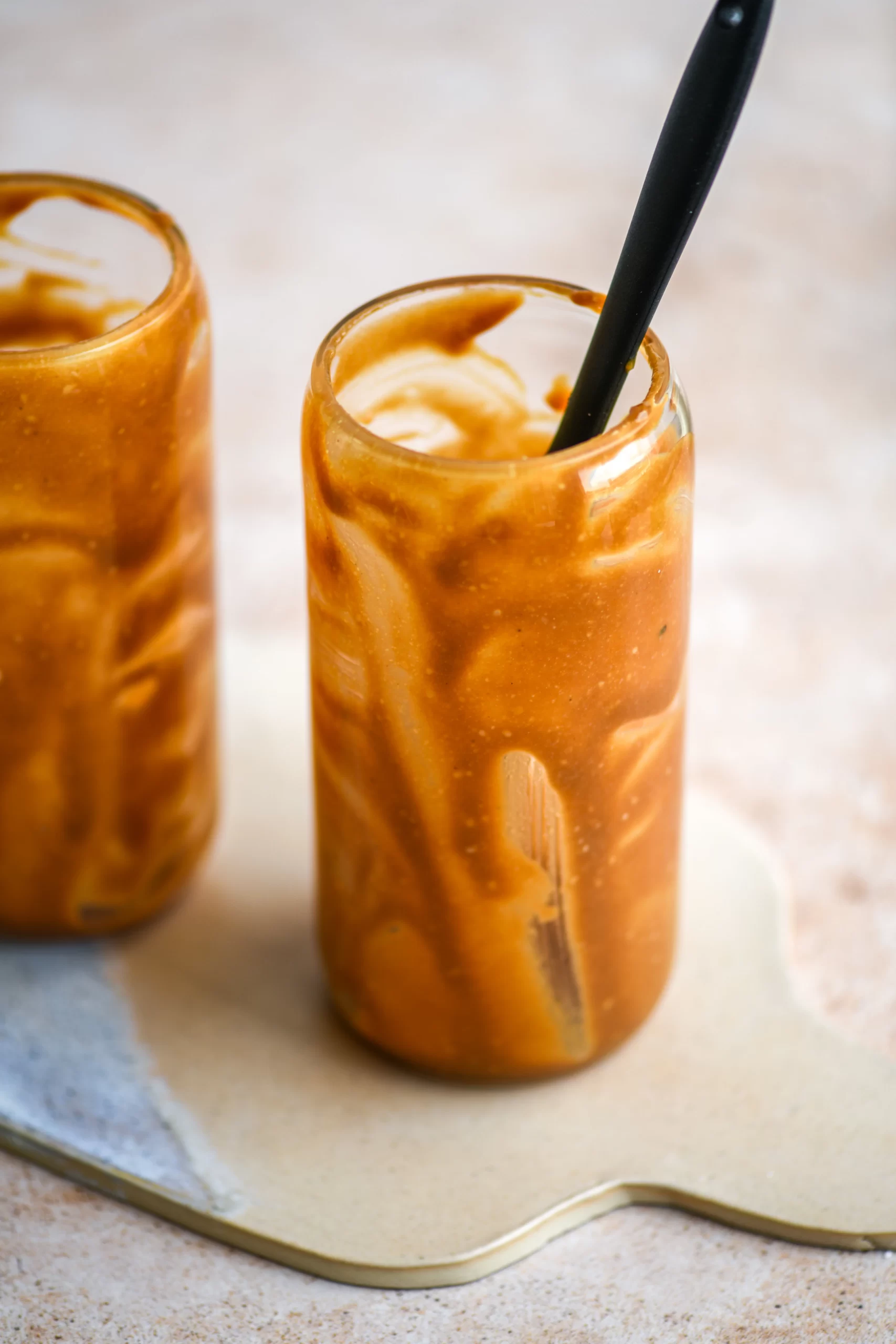 tahini caramel in glass with spatula